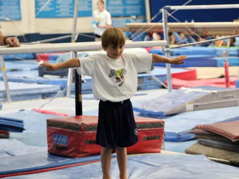 a boy standing on a boat