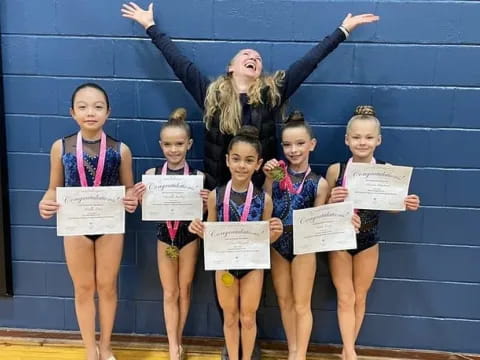 a group of girls holding signs