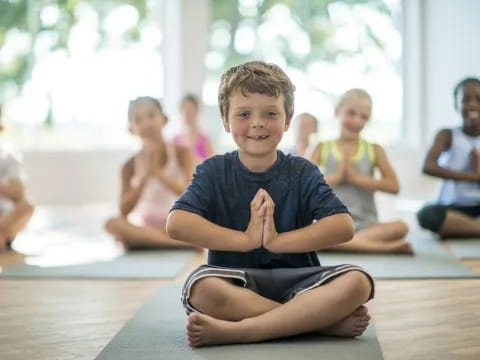 a boy sitting on the floor