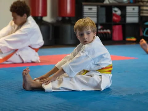 a boy in a karate uniform