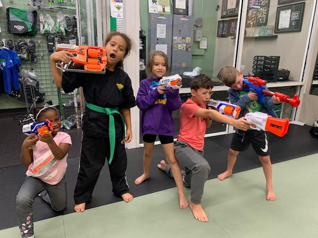 a group of children playing with toys