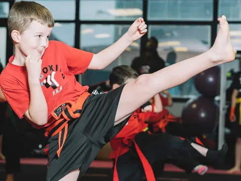 a boy in a red shirt
