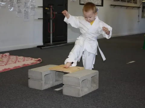 a boy in a white suit