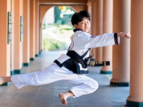 a boy in a karate uniform