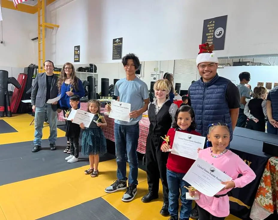 a group of people holding papers