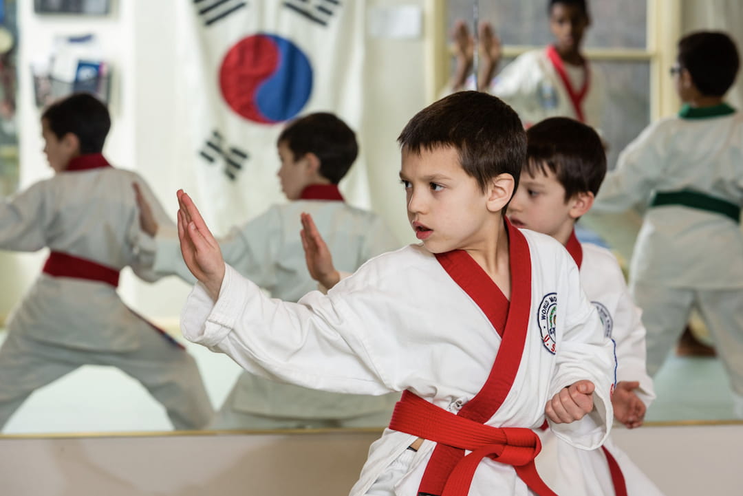 a group of boys in karate uniforms