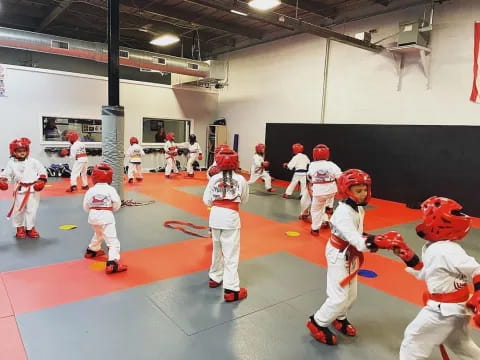 a group of kids in white uniforms
