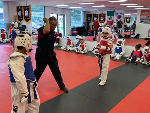 a person and two kids in clothing