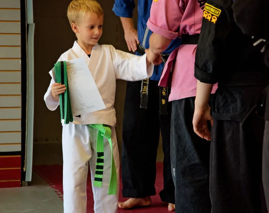 a boy holding a book