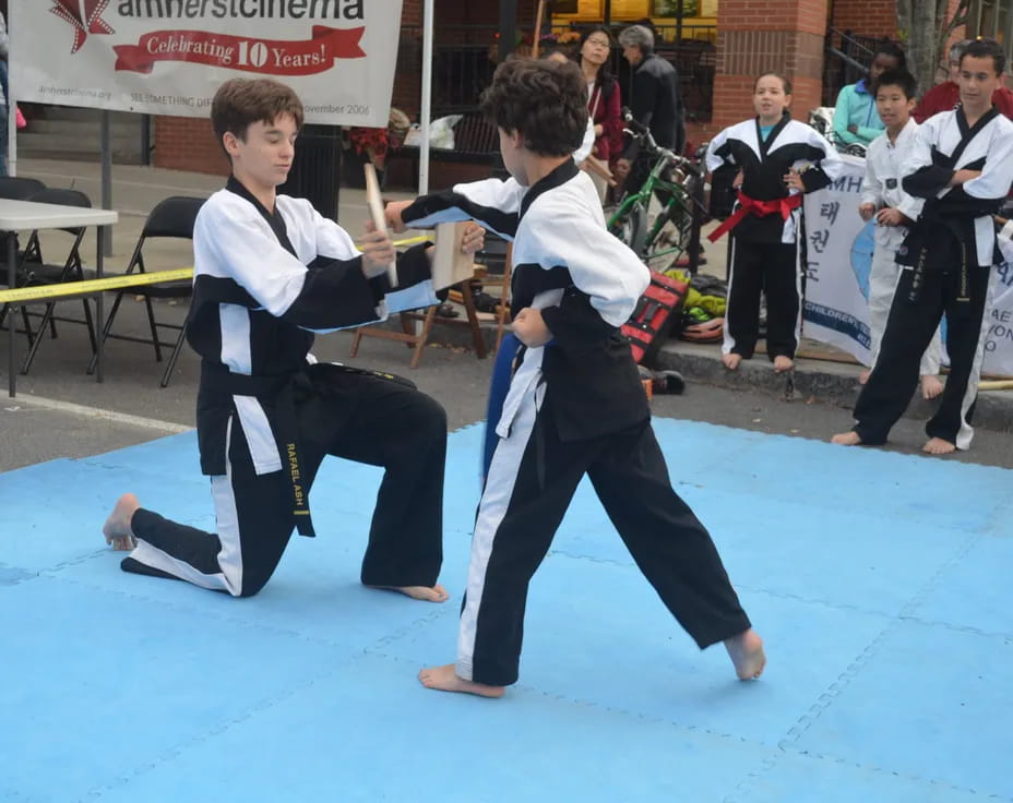 two boys in karate uniforms