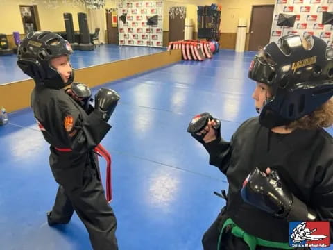 two people wearing helmets