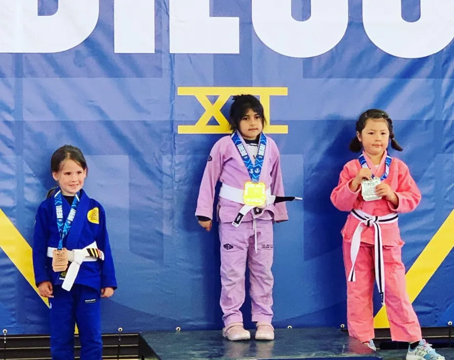 a group of people wearing medals