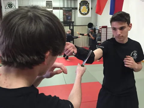a man cutting another man's hair