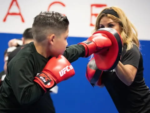 a man and woman boxing
