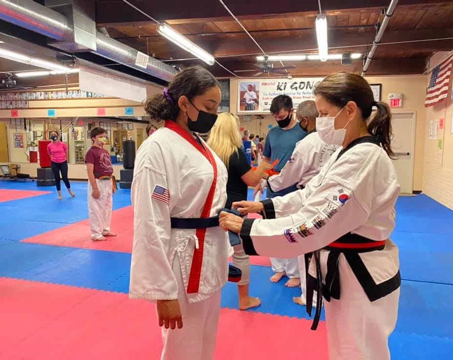 a group of women in karate uniforms