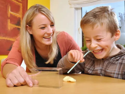 a woman and a boy smiling
