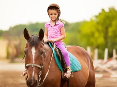a girl riding a horse