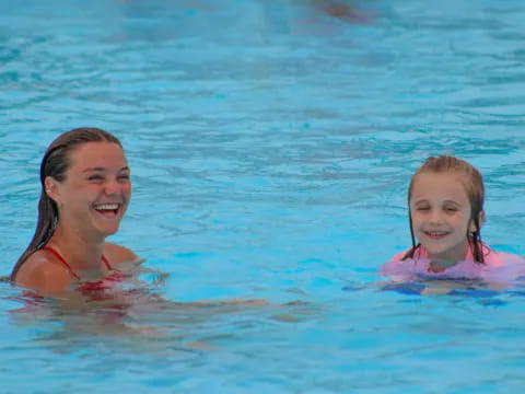 a woman and a child in the water