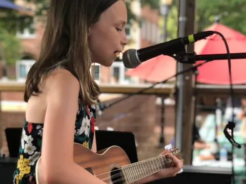 a woman playing a guitar