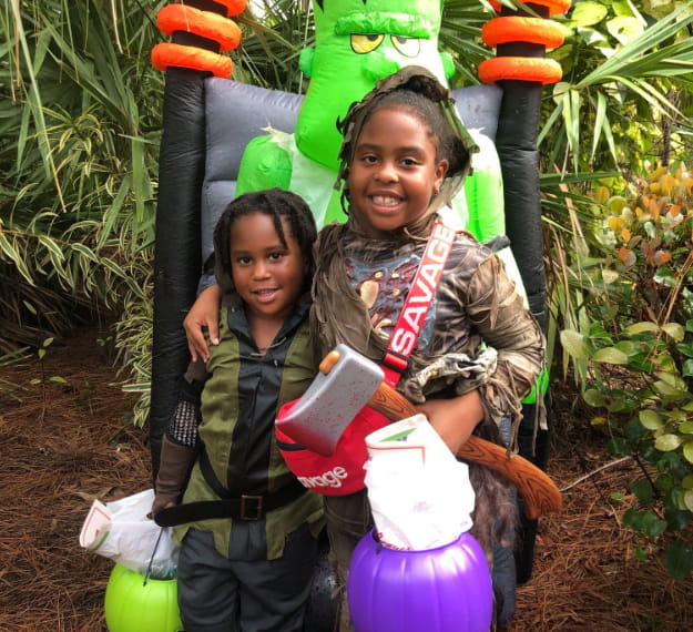 a couple of girls wearing clothing