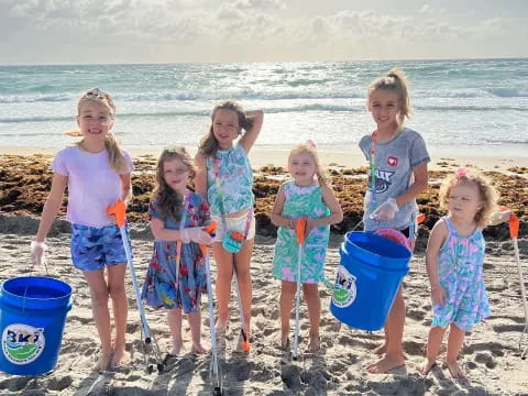 a group of children on a beach