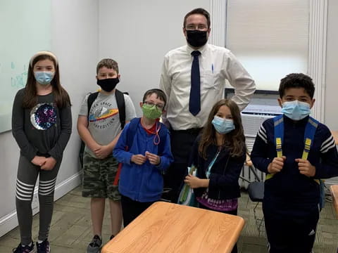 a group of people wearing masks