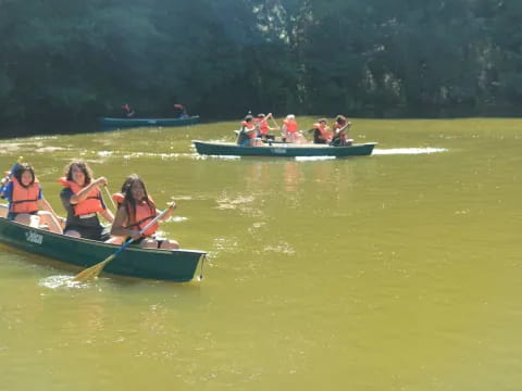 a group of people rowing a boat