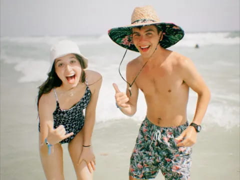 a man and woman on a beach