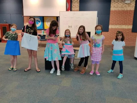 a group of girls in a room