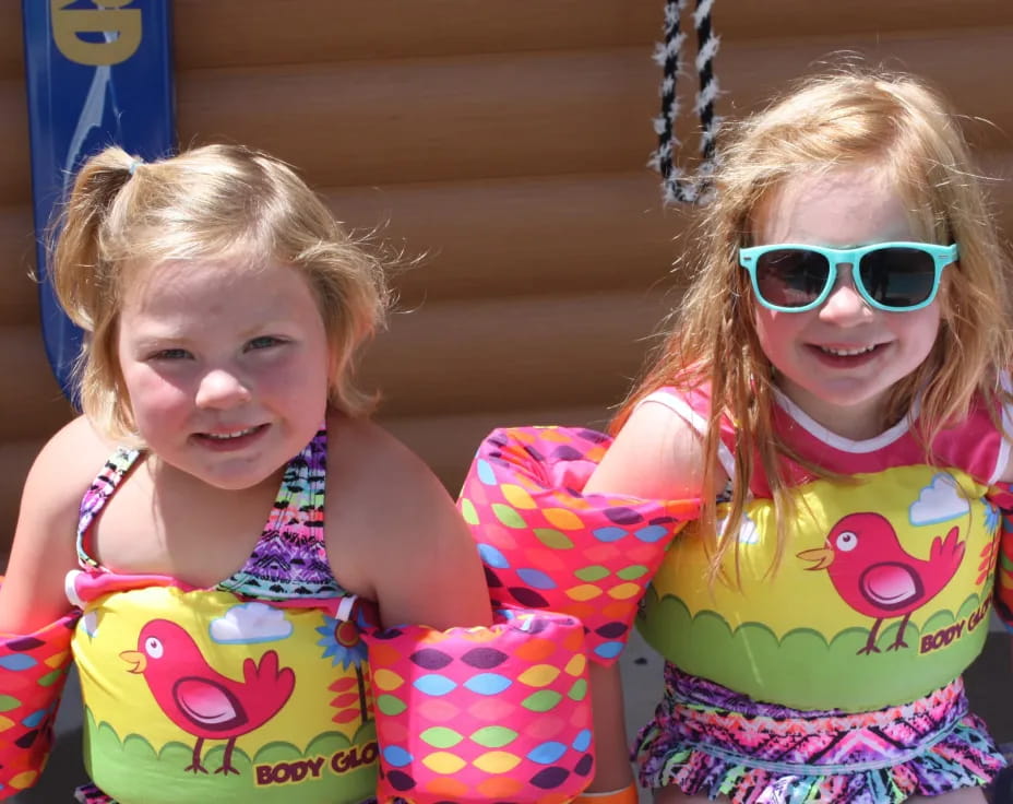 a couple of girls wearing clothing