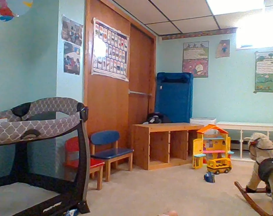 a room with bunk beds and a desk