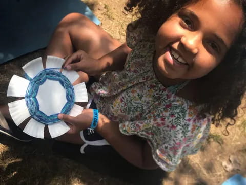a child holding a cup