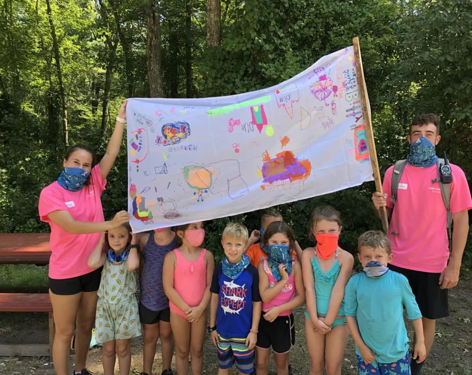 a group of children holding a flag
