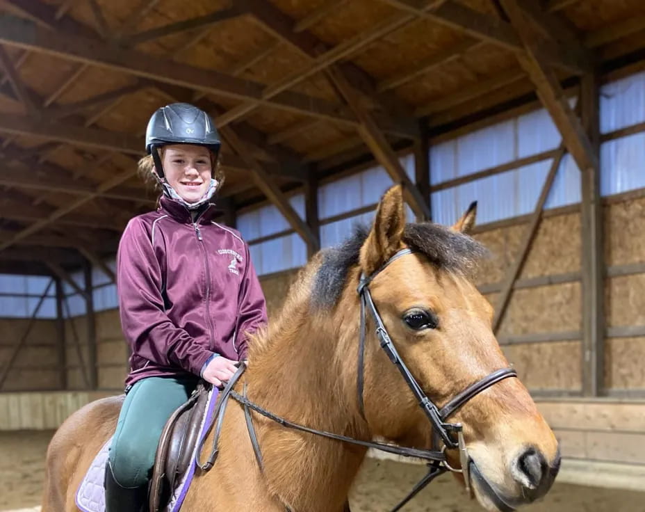 a girl riding a horse
