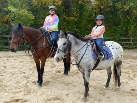 a group of people riding horses
