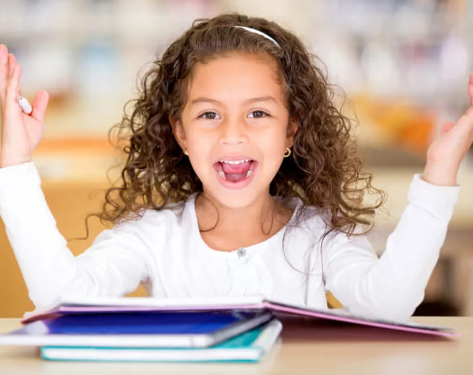 a girl raising her hands