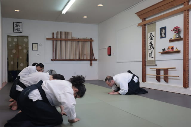a group of people in karate uniforms