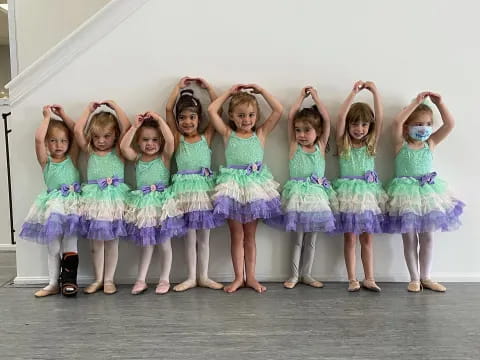 a group of girls in dresses