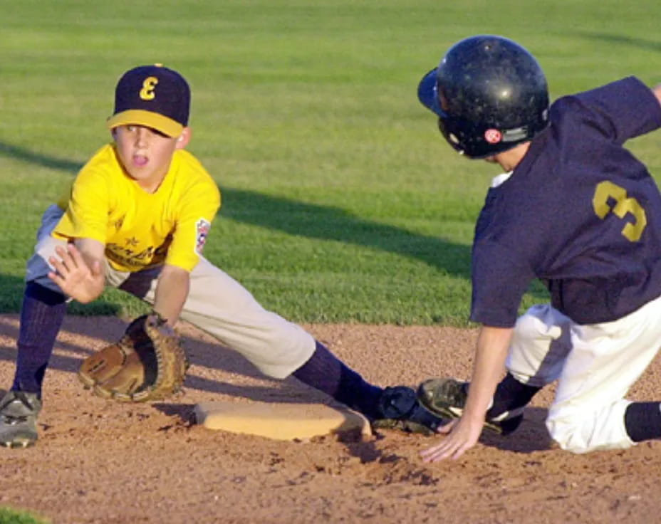 a couple of kids playing baseball