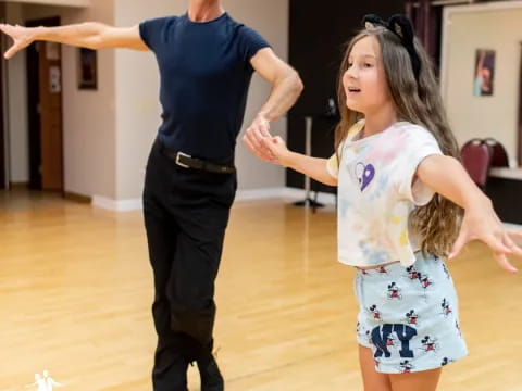 a person and a girl dancing