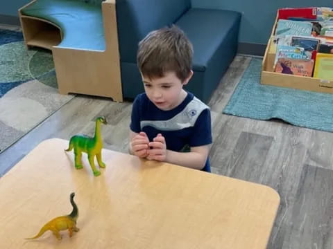 a child sitting at a table