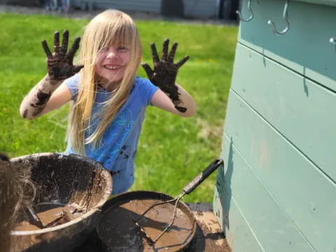 a girl with a gloved hand