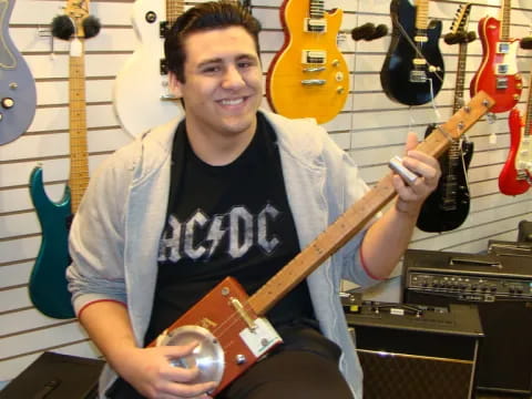 a person holding a guitar