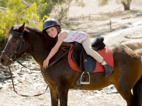 a girl riding a horse