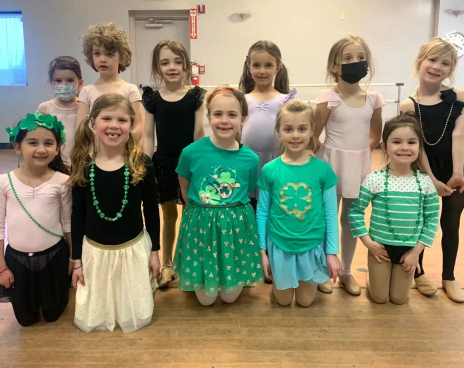 a group of girls posing for a photo