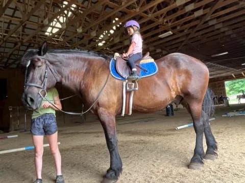 a girl riding a horse