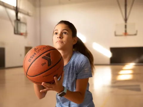 a person holding a basketball