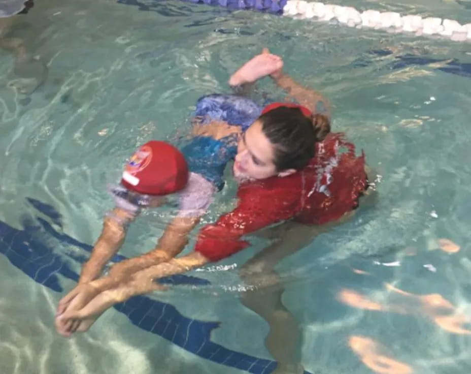 a couple of women in a pool