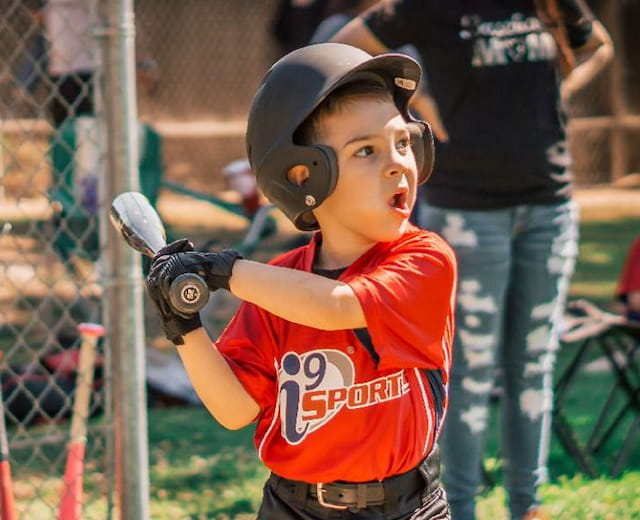 a young boy playing baseball