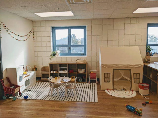 a room with a table and chairs